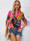 Tied Printed Notched Short Sleeve Blouse