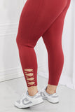 Yelete Ready For Action Full Size Ankle Cutout Active Leggings in Brick Red